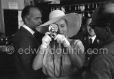 Zsa Zsa Gabor with a Kodak Starflash, her current boyfriend, millionaire Hal Hayes on the left. Cannes 1959. - Photo by Edward Quinn