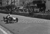 Stirling Moss, (22) Cooper Jap. Winner of the "The Prix de Monte-Carlo". The Prince's tribune with Prince Rainier in the background. Formula 3 Grand Prix, called "The Prix de Monte-Carlo". Monaco 1950. - Photo by Edward Quinn