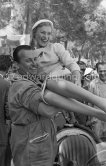 Bella Darvi, who had a leading role in the film "The Racers", supposed to be a flirt of Prince Rainier, and a mechanic of the Maserati Racing Team. Monaco Grand Prix 1955. - Photo by Edward Quinn