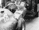 After the race: The crashed Vanwall VW3/V4 of Stirling Moss, beeing hold away after the race. Monaco Grand Prix 1957. - Photo by Edward Quinn