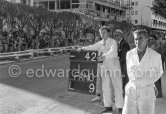 Behind the mechanic Stirling Moss and Tony Vandervell, head of the Vanwall Formula One racing team. Monaco Grand Prix 1957. Monaco Grand Prix 1957. - Photo by Edward Quinn