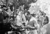 The ex Princess Bira, a South American, is all smiles over the Argentinean Fangio's victory. Monaco Grand Prix 1957. - Photo by Edward Quinn