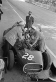 Stirling Moss, (28) Vanwall VW7, stops at the pits with valve problems. Tony Vandervell (white hat), founder of the Vanwall Formula One racing team. Monaco Grand Prix 1958. - Photo by Edward Quinn