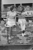 Monique Schell, Harry Schell's wife, and on the left another racing fan, Carine Kollen. Monaco Grand Prix 1959. - Photo by Edward Quinn