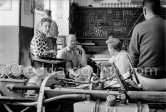 In a backstreet garage of Monte Carlo, Lance Reventlow (striped shirt), the driver-owner-constructor, helps to prepare his Scarab car for the race. On left his wife Jill St. John and chief mechanic and driver Chuck Daigh. Monaco Grand Prix 1960. - Photo by Edward Quinn