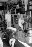 In a backstreet garage of Monte Carlo, Lance Reventlow, the driver-owner-constructor and John Cooper. Monaco Grand Prix 1960. - Photo by Edward Quinn