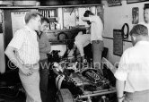 In a backstreet garage of Monte Carlo, Lance Reventlow, the driver-owner-constructor, helps to prepare his Scarab car for the race. Monaco Grand Prix 1960. - Photo by Edward Quinn