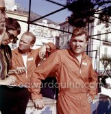 Lance Reventlow, the driver-owner-constructor of Scarab cars and Scarab driver and chief mechanic Chuck Daigh (left). They have her names stiched on the orange ovarall. Monaco Grand Prix 1960. - Photo by Edward Quinn
