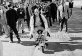 Stirling Moss enjoys riding around with his 1961 Trojan Trobike. Monaco Grand Prix 1961. - Photo by Edward Quinn