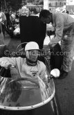 Stirling Moss, (20) Lotus-Climax. Alf Francis (right), chief mechanic of Rob Walker Racing Team. Monaco Grand Prix 1961. - Photo by Edward Quinn