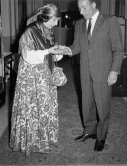 Stirling Moss in a Monaco nightspot after the Monaco Grand Prix 1961 with Gypsie fortune teller Madame Delyane. - Photo by Edward Quinn