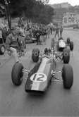 Jim Clark and Colin Chapman. Peter Arundell, (11) Lotus 25. Monaco Grand Prix 1964. - Photo by Edward Quinn