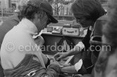 Before one of the trial runs, Niki Lauda's doctor gave him an injection and made a blood test. Laude rarely smiles, but submitted to this good humouredly. Monaco Grand Prix 1978. - Photo by Edward Quinn