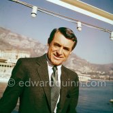 Cary Grant on board Onassis' yacht Christina. Monaco harbor 1957. - Photo by Edward Quinn