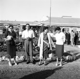 Moulay Hassan (later King Hassan II of Morocco), his sisters Malika, Nezla, Aicha. Nice Airport 1956. - Photo by Edward Quinn