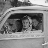 Rita Hayworth with her daughters Rebecca and Yasmina leaving Château de l’Horizon, property of Aly Khan. Golfe-Juan 1951. Car: Fiat 508 C/1100 Nuova Balilla, special-bodied woody-wagon. - Photo by Edward Quinn