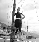 Hollywood actress Audrey Hepburn, before she found fame, at the harbor of Monaco 1951. - Photo by Edward Quinn