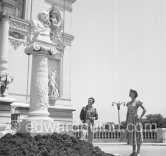 Audrey Hepburn and the French actor and dancer Edmond Audran, husband of Ludmilla Tcherina, looking at the bust of the french composer Jules Massenet in front of the Grande Salle Garnier, th opera house. Monte Carlo 1951. - Photo by Edward Quinn