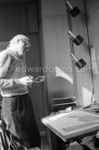 David Hockney working on the set design for "The Rake's Progress" at England’s Glyndebourne Opera Festival Paris 1975. - Photo by Edward Quinn