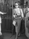 Grace Kelly with the original Kelly Bag arriving at Cannes station 1955. - Photo by Edward Quinn