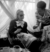 Grace Kelly signing a Paris Match magazine with her picture on the front. Cannes 1955. - Photo by Edward Quinn
