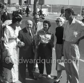 Grace Kelly and Gordon White (right), chairman of Hanson Industries. Marcel Carné, French film director, in the middle. Gladys de Ségonzac, costume designer (middle). Cannes Film Festival 1955. - Photo by Edward Quinn