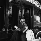 Grace Kelly arriving at the Cannes Railway Station, met by Alfred Hitchcock. It was the third time she was in Europe. In 1947 she came with the family, in 1949 on assignement, she was then a fashion model. Cannes 1954. - Photo by Edward Quinn