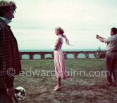 Grace Kelly during filming of "To Catch a Thief". The camera assistant measures the exposure. Cannes 1954. - Photo by Edward Quinn