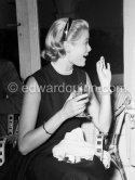 Grace Kelly during a press cocktail party at the Carlton Hotel, where she charmed everybody by trying out her French and emphasizing her words with gestures and expressions. Cannes 1954. - Photo by Edward Quinn