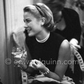 Grace Kelly during a press cocktail party at the Carlton Hotel, where she charmed everybody by trying out her French and emphasizing her words with gestures and expressions. Cannes 1954. - Photo by Edward Quinn