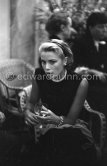 Grace Kelly during a press cocktail party at the Carlton Hotel, where she charmed everybody by trying out her French and emphasizing her words with gestures and expressions. Cannes 1954. - Photo by Edward Quinn