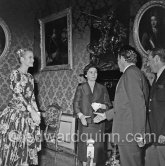 Prince Rainier III of Monaco meeting American film Star Grace Kelly (later to become Princess Grace) for the first time at his Monaco Palace in 1955. Here he greets her friend Gladys de Ségonzac, costume designer. - Photo by Edward Quinn