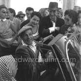 Gene Kelly, signing autographs. The American dancer, singer and choreographer was said to have danced more miles than walked. Cannes 1955. - Photo by Edward Quinn