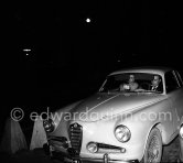 Miss Hannon, "mysterieous date of Prince Aly Khan", as the magazine "Paris Match" wrote, in his car driven by a concierge of the Hotel de Paris. After New Year’s Eve Gala dinner. Monte Carlo 1954. Car: Alfa Romeo 1900C Series 2 Sprint Coupé 1954. - Photo by Edward Quinn