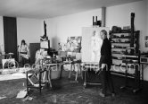 Louis le Brocquy and his wife Anne Madden le Brocquy at their studio with painting "Laussel Venus" by le Brocquy and under the easel "Land near Kilnaboy" by Madden. Carros 1964. - Photo by Edward Quinn