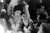 Gina Lollobrigida, centre of attraction, at the gala evening in aid of polio victims. Monte Carlo Sporting Club. Monte Carlo 1955. - Photo by Edward Quinn