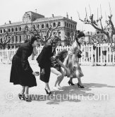 Gina Lollobrigida (right), Irene Papas (left) and two unknown actresses playing boule at Cannes 1952. - Photo by Edward Quinn