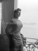 A privileged view: Sophia Loren looking out at the sea from her room in the Carlton Hotel. Cannes Film Festival 1955. - Photo by Edward Quinn