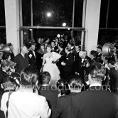 Sophia Loren, wearing an evening gown designed by Emilio Schuberth, making her entry to the Palais du Festival Cannes 27 April 1955. - Photo by Edward Quinn