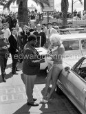 Jayne Mansfield, signing autographs, on a return trip to the Cannes Film Festival 1964. - Photo by Edward Quinn