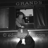 Somerset Maugham with his typewriter at the railway station of Beaulieu-sur-mer 1960. - Photo by Edward Quinn