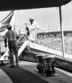 American gossip columnist Elsa Maxwell getting on board Onassis' yacht Christina. Monaco harbor 1956. - Photo by Edward Quinn
