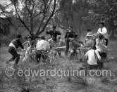 Paul Meurisse (white suit) during filming of “Le Déjeuner sur l'herbe” at the Auguste Renoir house "Les Collettes". With the aid of mechanical wind devices a tempest, the mistral, turns the déjeuner into catastrophe. Cagnes-sur-Mer 1959. - Photo by Edward Quinn