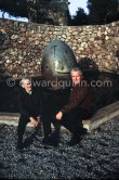 Joan Miró and Aimé Maeght in the gardens of Musée Maeght in front of a small pool with an "Oeuf cosmique" by Miró in center. Saint-Paul-de-Vence 1964. - Photo by Edward Quinn