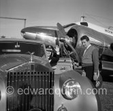 La Môme Moineau (the kid sparrow), "the richest woman of the Côte d'Azur", former flower seller, married to Mr. Benítez-Rexach, Puerto Rican ship building millionaire. On right the pilot. With one of her husbands gifts, a 1948 Rolls-Royce Silver Wraith, #LWAB63, 1950 Drophead Coupé Franay. Cannes Airport 1954. - Photo by Edward Quinn
