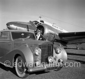 La Môme Moineau (the kid sparrow), "the richest woman of the Côte d'Azur", former flower seller, married to Mr. Benítez-Rexach, Puerto Rican ship building millionaire. With one of her husbands gifts, a 1948 Rolls-Royce Silver Wraith, #LWAB63, 1950 Drophead Coupé Franay. Cannes Airport 1954. - Photo by Edward Quinn