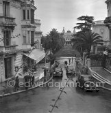 View of rainy Monte Carlo with Casino and Peugeots 1951. - Photo by Edward Quinn