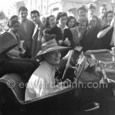 A must for a star at the Cannes Film Festival: a drive in an open car on La Croisette. Cannes 1954. Michèle Morgan, Car: MG TF 1953-1955 (round door binges) - Photo by Edward Quinn