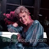 Kim Novak at Cannes in 1956, the year she was voted American number one box-ofﬁce star and Queen of the Cannes Film Festival. She lived up to her role by bringing 20 cocktail and evening dresses and 25 pairs of shoes for her one-week stay. - Photo by Edward Quinn