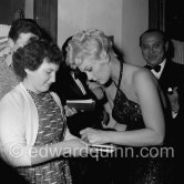 Kim Novak signing autographs at a gala evening, Cannes Film Festival 1956. - Photo by Edward Quinn